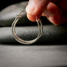 Sterling silver hammered hoop earrings 1"   A pair of earrings to go with everything!  These are so light and easy to wear, hammered for texture and hinged so they are easy to put on.  They are made of sterling silver by me in my studio and textured with an old beat up hammer my husband bought me about 10 years ago.  The texture is wonderful, you won't see it anywhere else.  They are a little over 1" in diameter. I can make these bigger or smaller or out of gold.  Please convo me with any special requests. I make other really great hoop earrings and you can see them here: http://www.etsy.com/shop/hartleystudio/search?search_query=hoop+earrings&search_submit=&search_type=user_shop_ttt_id_5388170&shopname=hartleystudio&langid_override=-1 All purchases come lovingly boxed and ready for giving Hammered Hoop Earrings, Hammered Silver, Jewelry Earrings Hoops, My Husband, Gift Tags, Porter, Hoop Earrings, Jewelry Earrings, Accessory Gift