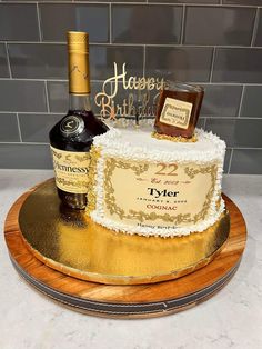 a birthday cake with a bottle of wine on top