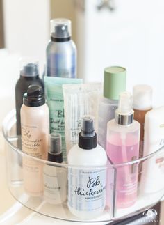 a clear container filled with lots of beauty products