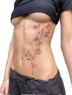 a woman's lower body with flowers on her stomach and the bottom part of her abdomen