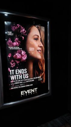 a poster on the side of a building that says it ends with us, event