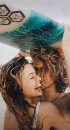 two people with surf boards on their heads