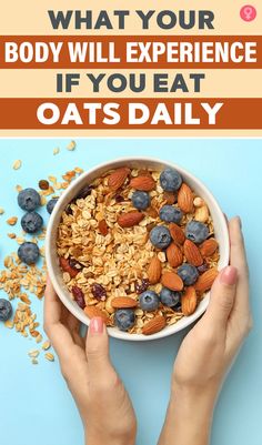 hands holding a bowl of oats with blueberries and almonds in it on a blue background