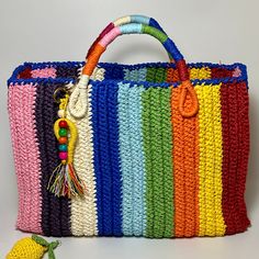 🌈The colorful straw summer bag is carefully woven with natural paper rope and completely handcrafted. It is unique and single production.  Thanks to its very large internal volume, you can easily carry your belongings in your bag for daily use, at the beach or on your travels. You can use it for many years with its thick and robust texture. It is lined with rose dyed linen fabric and has pockets. Rainbow colors match all your outfits. Bag ornament keychain included.  Our bag is an environmentally friendly product in line with slow and sustainable fashion. We take care that all our products are environmentally friendly and our content is clean.  Dimensions Height 28 cm Widht 42 cm Depth 17 cm 💐Care and Cleaning Tips Do not clean your bag by wetting it directly. You can wipe it with a clea Crochet Basket Bag, Holiday Summer, Woven Tote Bag, Dyed Linen, Summer Bag, Market Tote, Crochet Basket, Basket Bag, Crochet Handbags