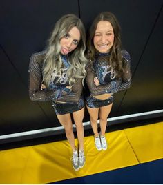 two women in sequins posing for a photo together with their arms around each other