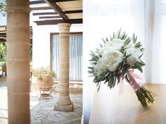 the flowers are in vases on the table and next to an outdoor dining area