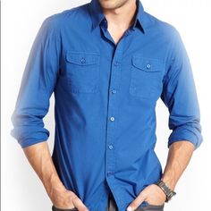 Go From Work To Weekend In This Long Sleeve Button Shirt. Folded Collar And Dual Chest Pockets. Front Button Closures. Signature Logo Patch On Bottom Corner. Color: Blue (More Of A Navy Blue, Color Was Difficult To Capture) 100% Cotton Machine Wash Armpit To Armpit: 19 Inches Across Shoulder To Shoulder: 16.75” Armpit To Cuff: 20.25” Top Shoulder To Bottom Hem 27 Inches Blue Button-up Shirt With Button Cuffs, Classic Blue Shirt With Roll-up Sleeves, Blue Workwear Shirt With Buttoned Pockets, Blue Button-up Shirt With Roll-up Sleeves, Blue Shirt With Buttoned Pockets For Work, Casual Blue Shirt With Buttoned Pockets, Blue Business Casual Shirt With Pockets, Blue Buttoned Shirt For Work, Fitted Button-up Shirt With Buttoned Pockets