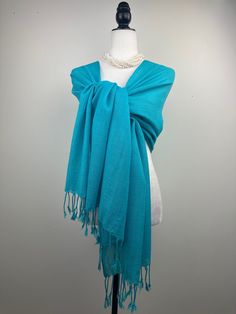 This is a light weight all season wool shawl. This versatile shawl can be used to dress up an outfit for a special evening, as wedding favors, travel wrap or as a neck scarf in the winter. Easy to carry anywhere, perfect for when you need it at a restaurant or at the office in air conditioning or a cool summer evening. Effortlessly give a dress a new look by simply adding this shawl. A must have when you travel! Measures 26"Wide x 74"Long COLOR MATCHING/ACURACY The color is very close however is Blue Shawl Wrap, Elegant Blue Pashmina Shawl, Blue Pashmina Shawl For Winter, Elegant Blue Pashmina Shawl For Winter, Blue Pashmina Shawl, Formal Shawl, Travel Wrap, Wool Shawl, Cool Summer