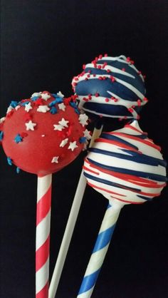 three red, white and blue lollipops with stars on them