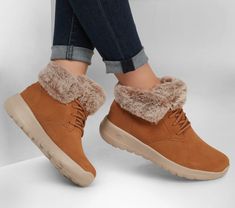 Laid-back style and cozy comfort combine in Skechers On-the-GO Joy - Plush Dreams. This slip-on cold-weather boot features a Scotchgard® treated suede upper with a faux-fur collar  Skechers Air-Cooled Goga Mat insole and lightweight 5GEN® cushioned midsole. Skechers Snow Boots, Skechers Women Ankle Boots, Snicker Bootsa For Women Shop, Skechers Boots Woman Winter Discontinued, Sketchers Shoes Boots, Skechers Women Boots, Skechers Shoes Women Slip On, Preppy Winter Shoes, Winter Boots Women Fashion