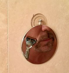 a man's face is reflected in a mirror with a hair dryer on it