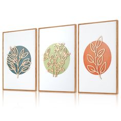 three framed art pieces with leaves on them in different colors and sizes, one is green, the other is orange