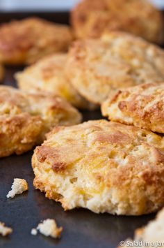 some biscuits are sitting on a baking sheet