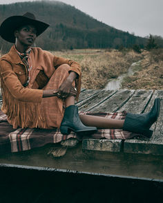 This ankle bootie is a modern combination of Western and Chelsea styles. Made from soft leathers, suedes, and metallic accents, the Sacha Chelsea has a sleek western toe, elastic gore inserts at the sides, and a pitched heel for day to night comfort. Available in a range of elevated neutral hues, this style seamlessly pairs with everything from vintage dresses to skinny jeans.This ankle bootie is a modern combination of Western and Chelsea styles. Made from soft leathers, suedes, and metallic accents, the Sacha Chelsea has a sleek western toe, elastic gore inserts at the sides, and a pitched heel for day to night comfort. Available in a range of elevated neutral hues, this style seamlessly pairs with everything from vintage dresses to skinny jeans. Ankle Bootie, Metallic Accents, Ankle Booties, Soft Leather, Vintage Dresses