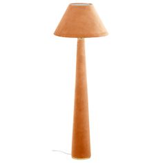 an orange floor lamp with a beige shade on it's base and a white background