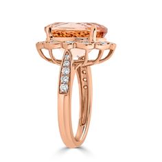 Designed with 14K rose gold, the unmatched charm of this elegant ring complements your distinct style perfectly. Set with a radiant oval cut Morganite, it is bordered by glittering round cut Diamonds that draw attention wherever you go. Product Information SKU 10446 Metal Type 14K Metal Color Rose Gold Ring Style Fashion Primary Stone Gemstone Name Morganite Gemstone Species Beryl No. Of Gemstones 1 Gemstone Shape Oval Gemstone Weight 7.39 Gemstone Size 14x11 Origin Africa Secondary Stone Gemsto Luxury Oval Rose Gold Diamond Ring, Radiant Cut Rose Gold Ring With Gemstone, Luxury Rose Gold Radiant Cut Rings, Luxury Oval Halo Ring In Rose Gold, Luxury Oval Rose Gold Halo Ring, Rose Gold Diamond Ring With Radiant Cut Accents, Oval Rose Gold Diamond Ring With Halo, Luxury Rose Gold Radiant Cut Diamond Ring, Dazzling Oval Rose Gold Diamond Ring