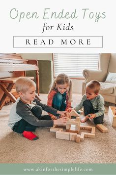 three children playing with wooden toys on the floor