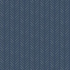 a blue and white herringbone pattern wallpaper with diagonal lines on the back ground