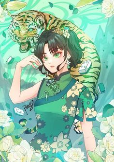 a woman in a green dress with a tiger on her shoulder and flowers around her neck