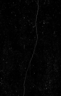 a black and white photo of a lightning bolt in the night sky with stars all around