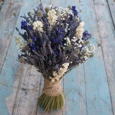 a bunch of flowers that are sitting on a table