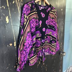 "Vintage 90's rayon tied front abstract mixed print top. Bright purple floral print on rayon with a neck cut and tie front. A mismatched but coordinating panel sewn inside the v neck, for a layered look. Keyhole back with button. Made by Essay by Sharon Anthony. Great vintage condition. Size 12, will fit medium/large. Measurements laying flat: fabric has some give. Armpit to armpit: 23\" Length: 23\" Sleeve length: 26\"" Festival Floral Print Rayon Blouse, Purple Floral Print, Bright Purple, Unique Dresses, Mixing Prints, Layered Look, Babydoll Dress, Print Top, Purple Floral