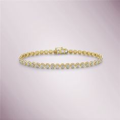 A diamond micro-pavé tennis bracelet in 14K gold is a stunning piece of jewelry that features a row of small, closely set diamonds that create a continuous sparkling surface. The carat weight of the diamonds is 0.50, which means there are half a carat of diamonds in the bracelet. The micro-pavé setting is a popular technique that involves setting small diamonds close together in a continuous row, creating a sparkling, uninterrupted surface of diamonds. This type of setting requires exceptional craftsmanship and attention to detail, making it a high-end and luxurious choice for jewelry. The tennis bracelet style is a classic and elegant design that features a flexible band of metal set with diamonds. This allows the bracelet to conform to the shape of the wrist for a comfortable and secure Bracelets 2023, Gold Book, Diamond Tennis Bracelet, Tennis Bracelet Diamond, Travel Jewelry, Jewelry Packaging, Micro Pave, Tennis Bracelet, Jewelry Lover