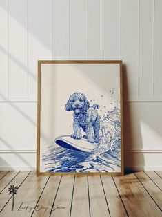 a blue and white print of a dog riding a surfboard in the ocean on a wooden floor