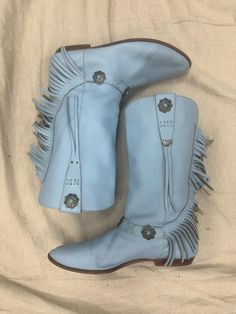 Beautiful baby blue boots adorned with fringe and silver conchos. Blue Western Festival Boots, Western Style Blue Festival Boots, Blue Western Style Festival Boots, Western Boots With Tassels And Round Toe, Western Style Light Blue Round Toe Boots, Bohemian Blue Boots With Round Toe, Blue Bohemian Boots With Round Toe, Blue Bohemian Round Toe Boots, Baby Blue Boots