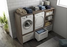 a washer and dryer sitting next to each other in a room with tile walls