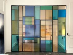 an open door with multicolored glass panels on it