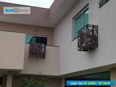 an apartment building with two balconies on the second floor