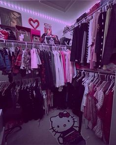 a closet with hello kitty shirts and other items