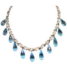 Luxury Dazzling Topaz Jewelry, Luxury Topaz Jewelry With Gemstone Accents, Fine Jewelry Topaz Necklaces With Diamond Accents, Luxury Diamond Cut Topaz Necklace, Blue Topaz Drop Necklaces, Luxury Classic Topaz Necklaces, Luxury Topaz Necklace With Diamond Accents, Luxury Topaz Necklace With Gemstone Accents, Blue Topaz Crystal Necklaces