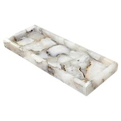 a marble tray with white and brown designs on the edges, sitting on a white background