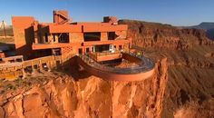 an aerial view of a building on top of a cliff