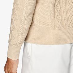 Give any casual look some pronounced pattern and robust texture with this light brown sweater. Comfortably knitted with a bold cross-cable pattern, it features a fine rib along the slightly tapered hem, cuffs, and crewneck collar. Beige Textured Knit Polo Sweater, Beige Cable Knit Turtleneck Cardigan, Classic Beige Cable Knit Sweater, Cream Crew Neck Cardigan With Ribbed Cuffs, Beige Cable Knit Crew Neck Sweater, Beige Crew Neck Polo Sweater, Classic Crew Neck Cable Knit Cardigan, Classic Brown Cable Knit Sweater, Light Brown Sweater