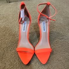 Never Worn About 3in Heel Orange Ankle Strap Heels With 4-inch Heel, Spring Orange Heels With 4-inch Heel, Orange Ankle Strap Heels With Stacked Heel, Orange High Heels With Padded Heel, Orange Heels With Sculpted Heel For Spring, Orange Padded High Heels, Formal Orange Heels With Reinforced Heel, Orange Block Heels With Wrapped Heel, Orange Pointed Toe Heels With Sculpted Heel