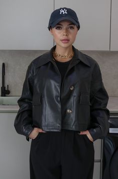 Collared Faux Leather Jacket | Color: Black | True To Size | Front Pockets and Hidden Buttons | Oversized and Relaxed Fit | Single Breasted | Cuffed and Buttoned Wrists | Cool and Breathable | Double Lined | Self: 60% Polyester, 40% Polyurethane, Lining: 100% Polyester | Hand Wash Cold, Do Not Bleach Available in Black and Beige Trendy Collared Biker Jacket For Work, Collared Faux Leather Winter Outerwear, Trendy Collared Faux Leather Outerwear, Trendy Faux Leather Outerwear With Pockets, Black Leather Cropped Jacket For Fall, Black Leather Cropped Jacket For Work, Black Faux Leather Outerwear With Button Closure, Chic Faux Leather Outerwear For Streetwear, Oversized Black Biker Jacket For Work