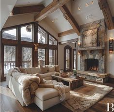 a living room filled with furniture and a fire place in the middle of a room