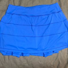 Feels And Looks The Same As Lululemon. Worn Once. Size Small. Great Condition Casual Blue Tennis Skirt For Sports, Blue Sporty Tennis Skirt With Lining, Sporty Blue Lined Tennis Skirt, Blue Skirt With Built-in Shorts, Blue Sports Skort With Pockets, Blue Stretch Tennis Skirt With Pockets, Stretch Blue Tennis Skirt With Pockets, Blue Casual Sports Skirt, Sporty Blue Skirt For Spring