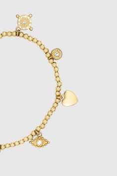 Adorned with a mix of celestial shapes, hearts, and crystals, this beaded gold bracelet will add the perfect finishing touch to all your looks. | Rebecca Minkoff Celestial, Hearts, & Crystal Charm Beaded Bracelet In Gold Gold Metal Charm Bracelet With Heart Beads, Gold Beaded Bracelets With Dangling Beads, Elegant Gold Crystal Bracelet With Heart Charm, Gold Beaded Bracelets With Charms And Round Beads, Gold Bracelets With Dangling Beads For Gift, Adjustable Gold Heart Crystal Bracelet, Adjustable Gold Heart-shaped Crystal Bracelet, Adjustable Gold Crystal Heart Bracelet, Gold Beaded Bracelets With Heart Charm