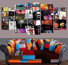 a couch sitting in front of a wall with pictures on it's back side