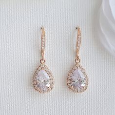 Pretty and sparkly, the Emma rose gold bridal earrings are great as simple wedding dangle earrings or bridesmaid earrings. Small Clear Cubic Zirconia detailed teardrops in a halo setting dangle from cubic zirconia detailed rose gold plated brass earwires. They are light weight and easy for all day wear. Material used is rose gold plated brass. I also have them available in silver/rhodium finish and 14k gold finish. Also available with a matching necklace. # length of Earring from top is approx 1 Crystal Drop Earrings Wedding, Wedding Dangle Earrings, Drop Earrings Wedding, Rose Gold Bridal Earrings, Dangle Earrings Wedding, Emma Rose, Gold Bridal Earrings, Earrings Teardrop, Rose Gold Bridal