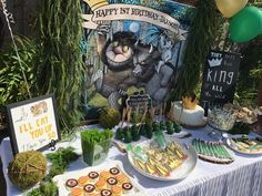 a table topped with lots of food and desserts