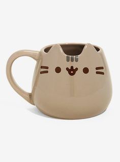 a coffee cup with a cat face on it