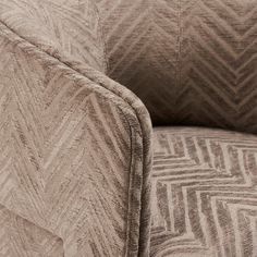 a close up view of the back end of a chair with a chevron pattern on it