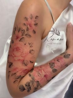 a woman's arm with flowers on it