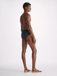 Our mid-height brief has a closed front for a clean and classic look. We chose a super-soft binding to finish the hems; all part of our quest for a minimalist streamlined look and the ultimate in softness and comfort. Crafted from a unique blend of 92% pima cotton and 8% elastane for added stretch, they're the perfect feel-good choice for sleeping, lounging and day-to-day wear. The model is 6'2" / 189cm tall. He wears a size Medium. Classic Seamless No-show Bottoms, Modern Seamless High-cut Leg Bottoms, Sleek Second-skin Solid Bottoms, Modern Bottoms With Smoothing High-cut Leg, Modern Fitted Brief Bottoms, Sleek Second-skin Bottoms With Smoothing Detail, Sleek Second-skin Smoothing Bottoms, Classic Stretch Bottoms With Moderate Coverage, Solid Color Bottoms With Moderate Back Coverage