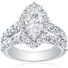 a pear shaped diamond engagement ring with two rows of diamonds on the band and shoulders